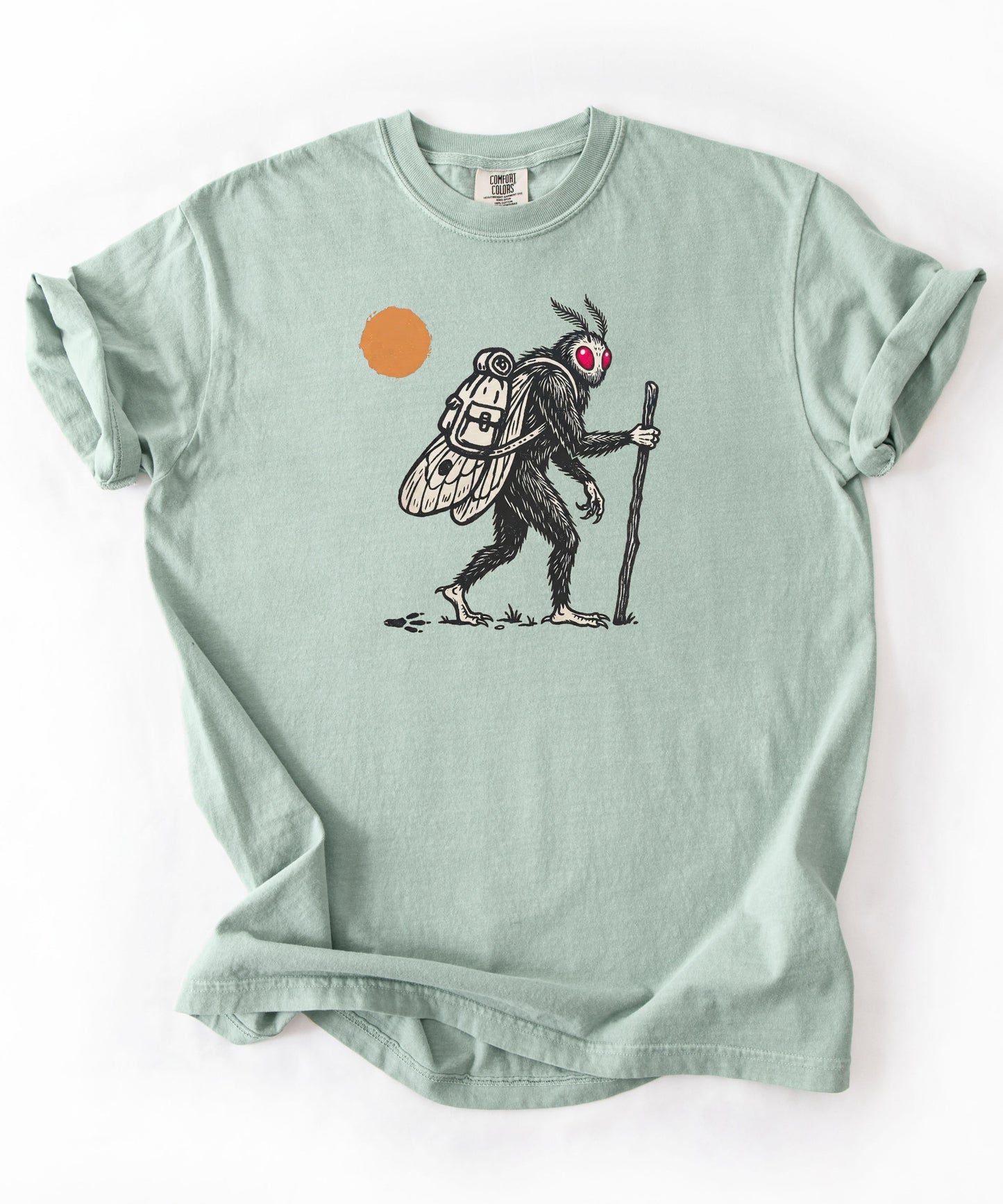 Mothman Traveler Graphic T-Shirt in Bay — backpacking cryptid tee with sun