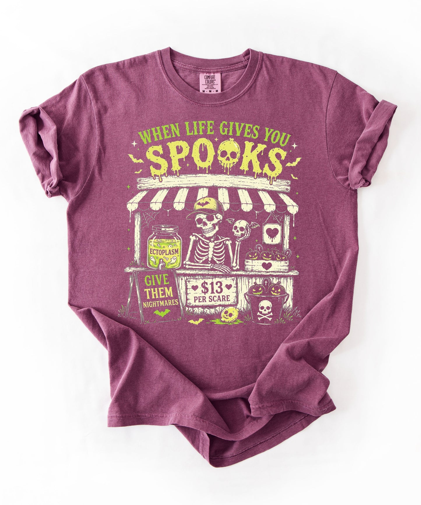 Halloween Skeleton Stand graphic tee in Berry — goth skeleton t-shirt with "When Life Gives You Spooks" design