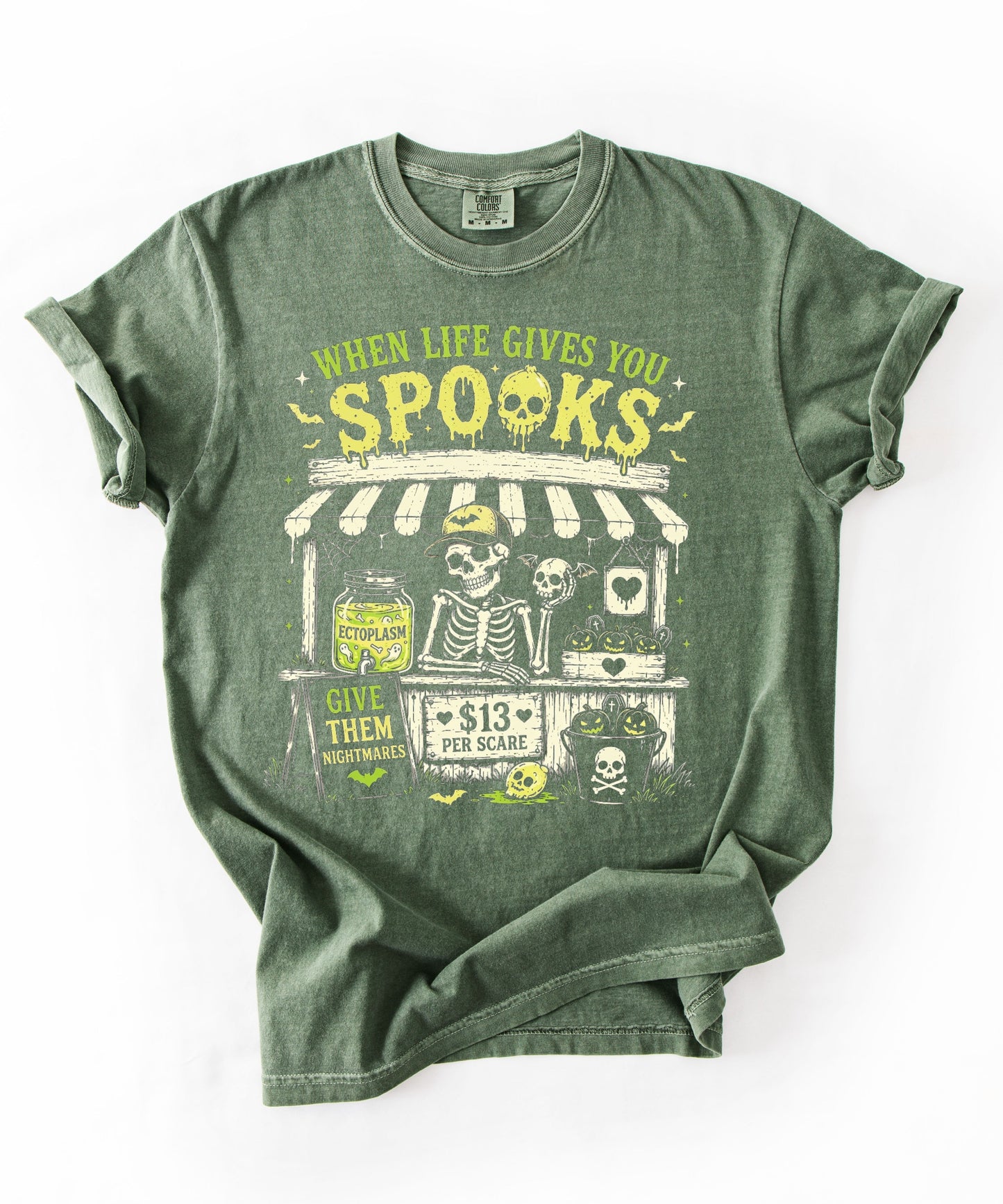 Halloween Skeleton Stand graphic tee in Moss — goth skeleton t-shirt with "When Life Gives You Spooks" design