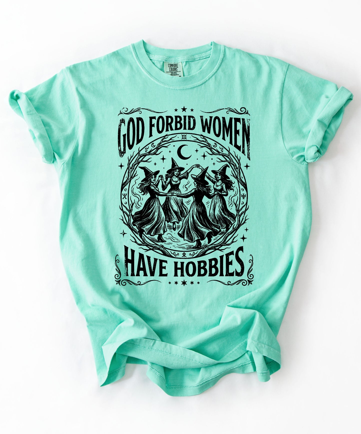 God Forbid Women Have Hobbies graphic t-shirt in Island Reef — vintage witch print on garment-dyed heavyweight cotton tee.
