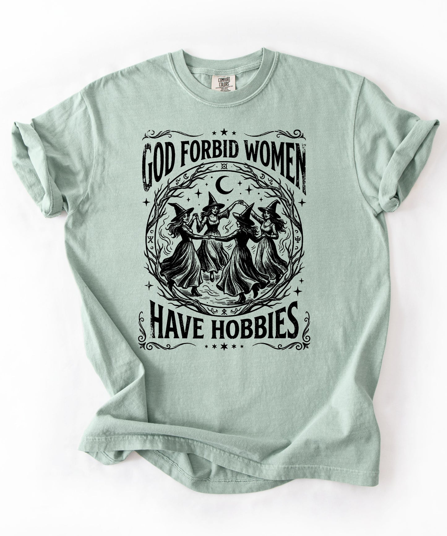 God Forbid Women Have Hobbies graphic t-shirt in Bay— vintage witch print on garment-dyed heavyweight cotton tee.
