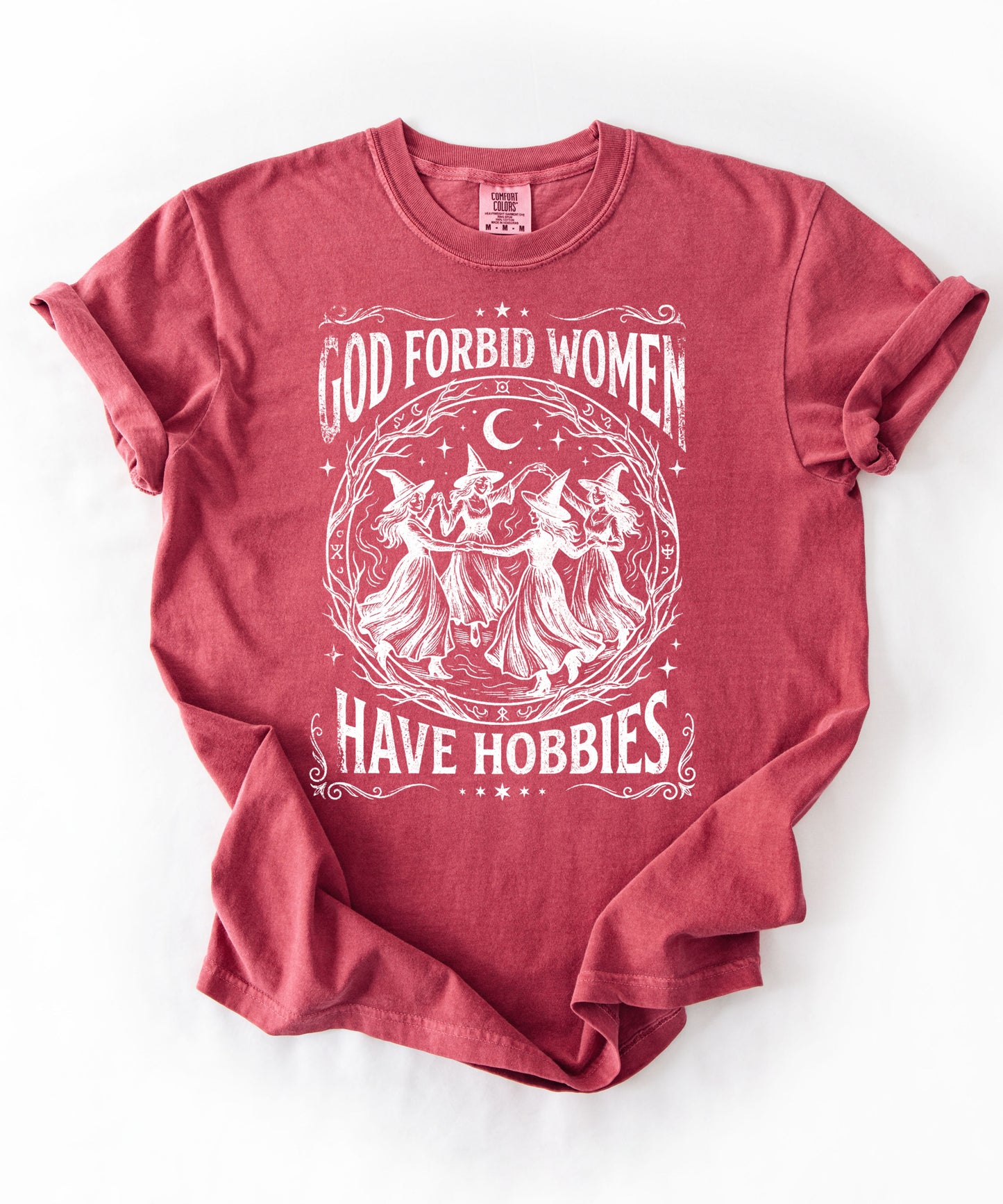 God Forbid Women Have Hobbies graphic t-shirt in Crimson — vintage witch print on garment-dyed heavyweight cotton tee.
