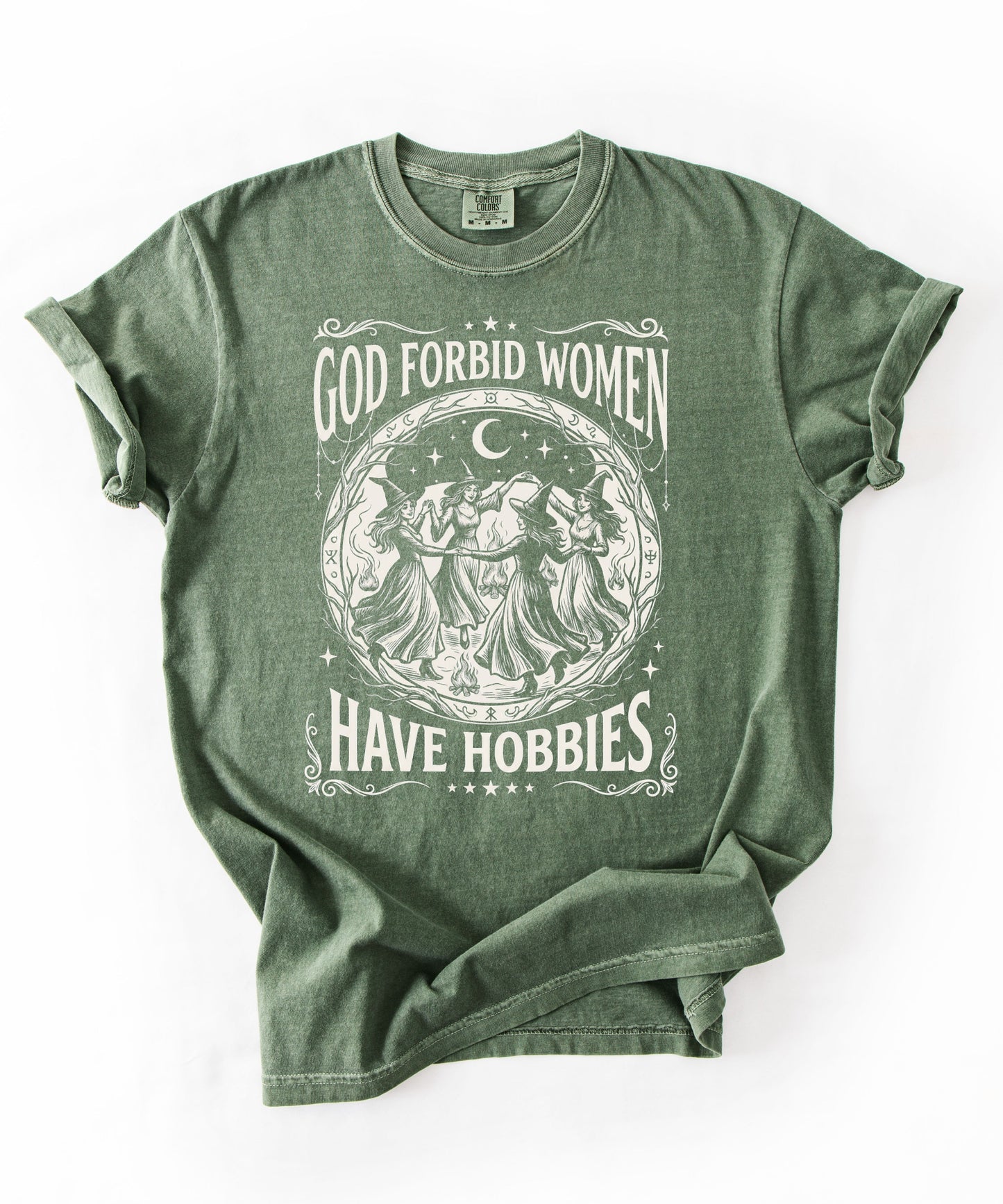 God Forbid Women Have Hobbies graphic t-shirt in Moss — vintage witch circular print on garment-dyed heavyweight cotton tee.