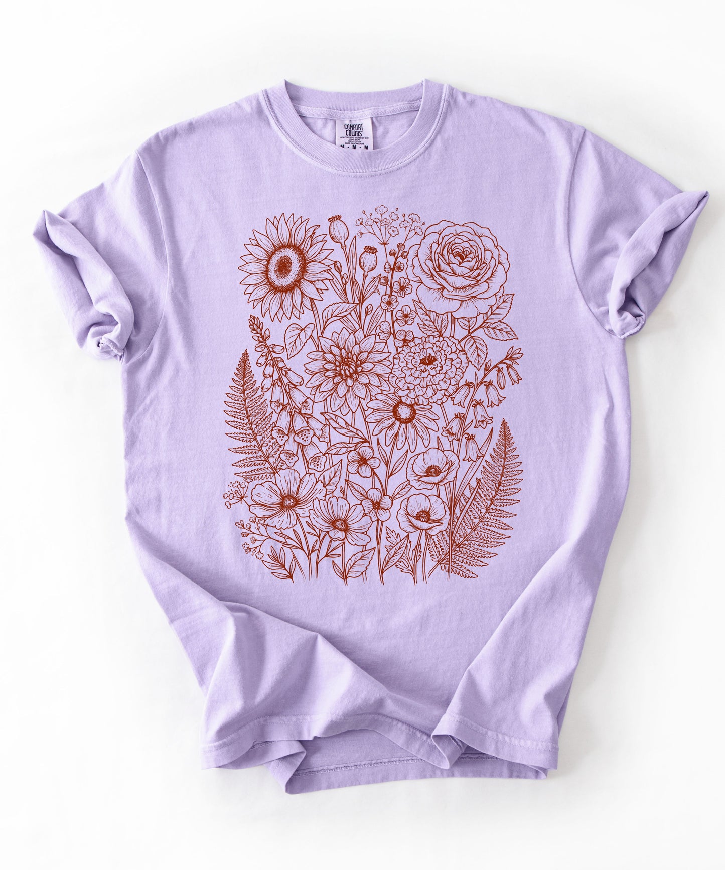 Comfort Colors® Orchid shirt with hand-drawn botanical line art print featuring sunflower, rose, dahlia, and wildflowers