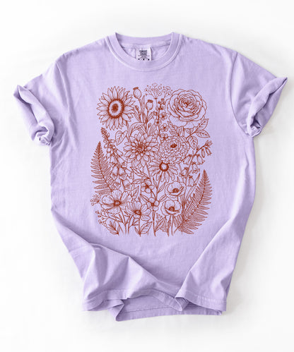 Comfort Colors® Orchid shirt with hand-drawn botanical line art print featuring sunflower, rose, dahlia, and wildflowers