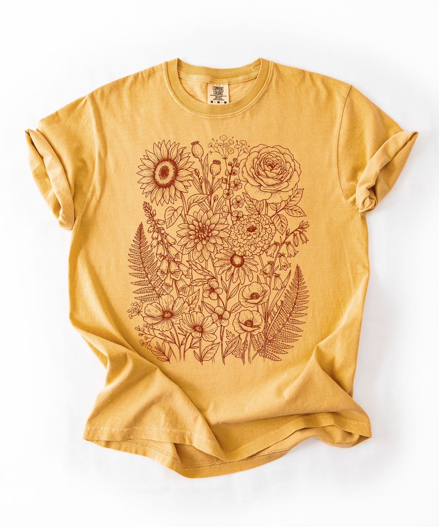 Comfort Colors®Mustard shirt with hand-drawn botanical line art print featuring sunflower, rose, dahlia, and wildflowers