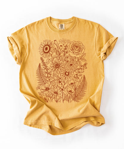Comfort Colors®Mustard shirt with hand-drawn botanical line art print featuring sunflower, rose, dahlia, and wildflowers