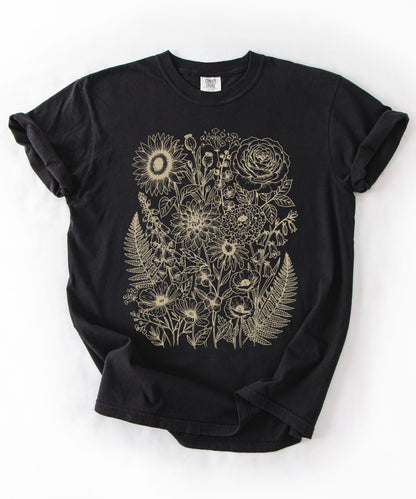 Comfort Colors® Black shirt with hand-drawn botanical line art print featuring sunflower, rose, dahlia, and wildflowers