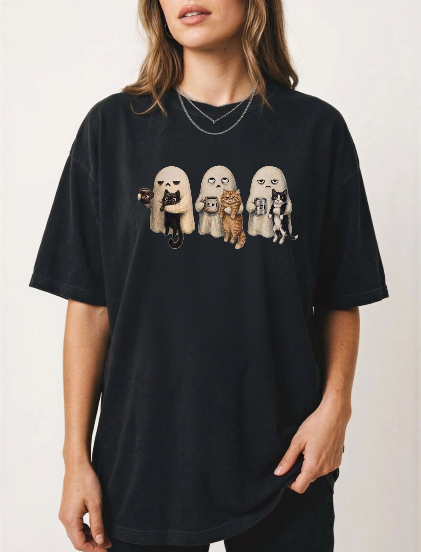 Ghost Cat graphic tee in Black with spooky ghost and cat illustration — funny introvert Halloween shirt for cat lovers