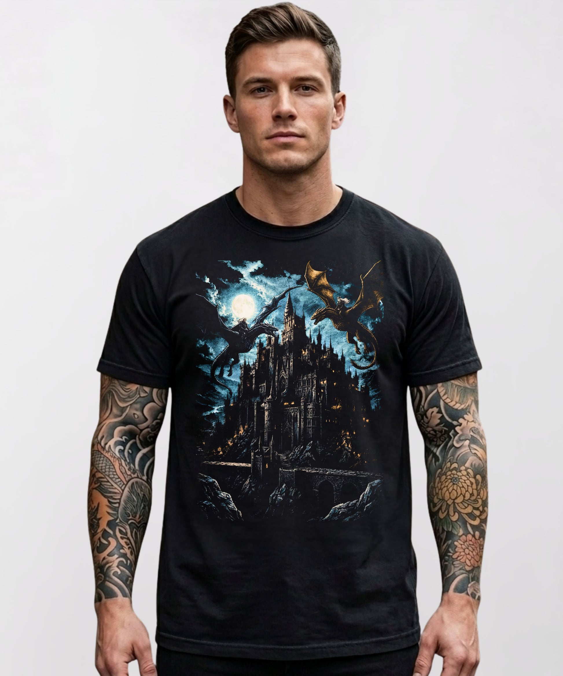 Model wearing a black heavyweight graphic t-shirt with a dark fantasy gothic castle and dragon design on the chest, styled casually.