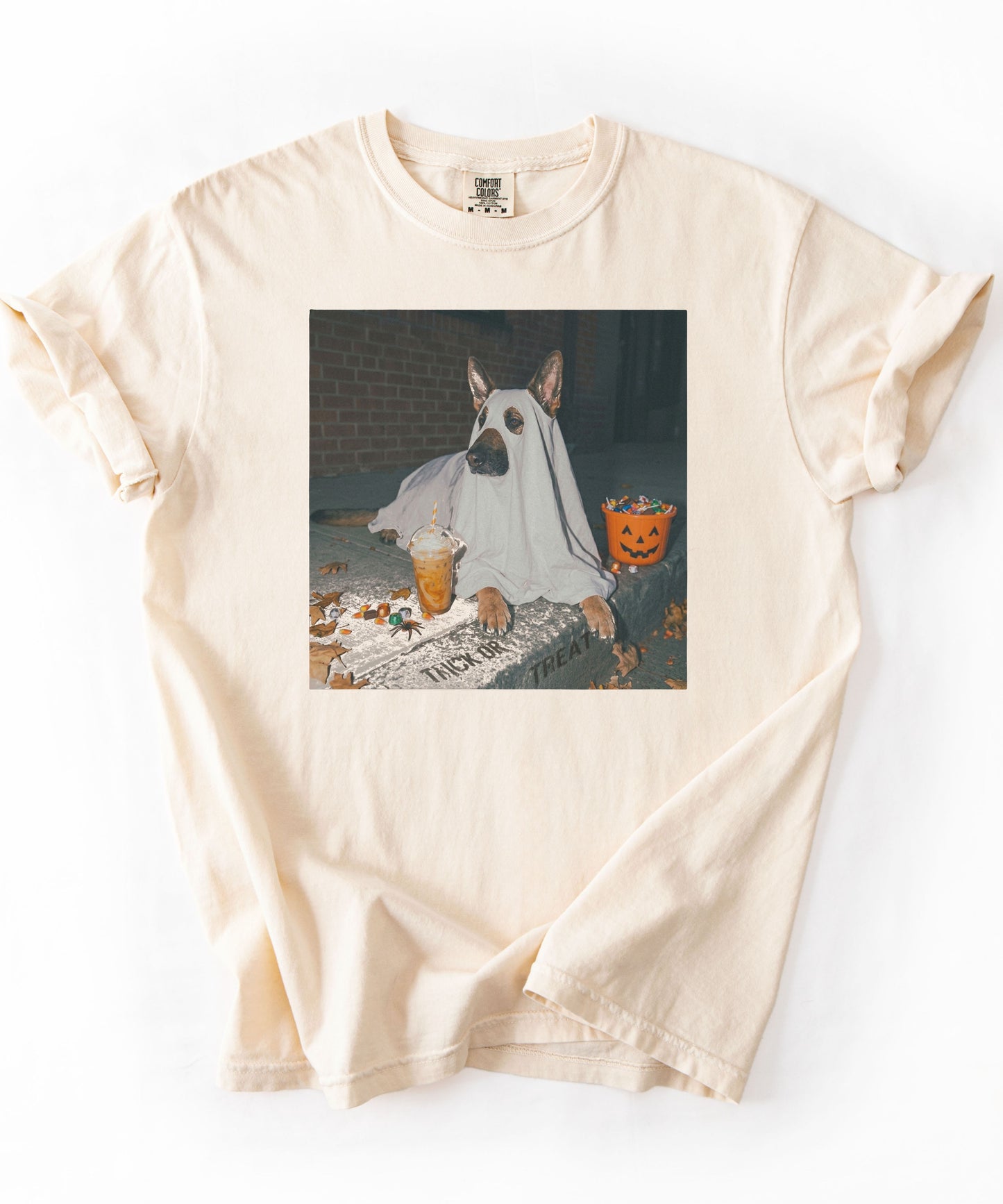 Ivory garment-dyed t-shirt with German Shepherd in ghost costume jack-o'-lantern treat bucket — Halloween ghost dog tee by GodaStudio