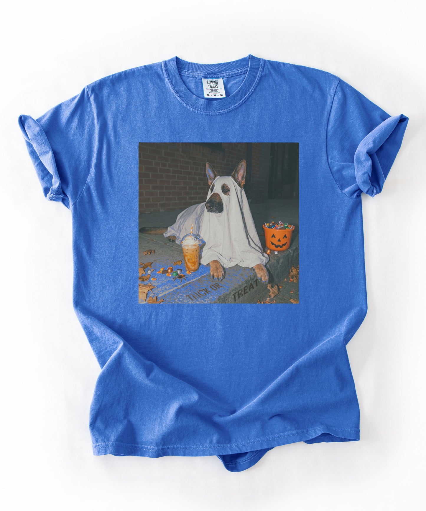 Flo Blue  garment-dyed t-shirt with German Shepherd in ghost costume jack-o'-lantern treat bucket — Halloween ghost dog tee by GodaStudio