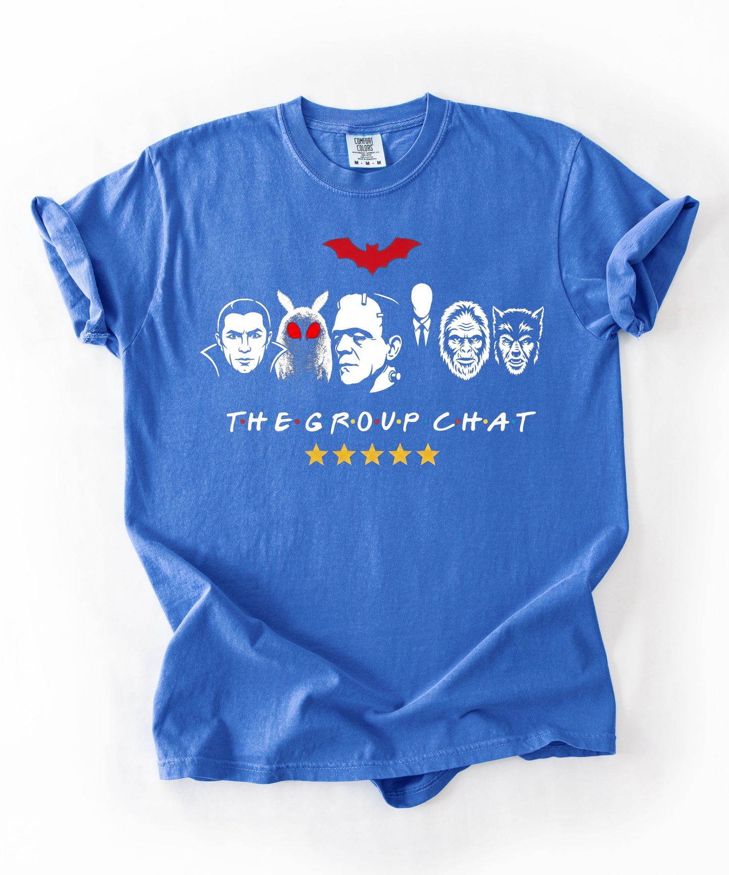 Flo Blue garment-dyed unisex t-shirt featuring The Group Chat horror monster squad graphic — Dracula, Mothman with red eyes, Frankenstein, Slender Man, Bigfoot, and Werewolf faces with red bat above and five gold stars below