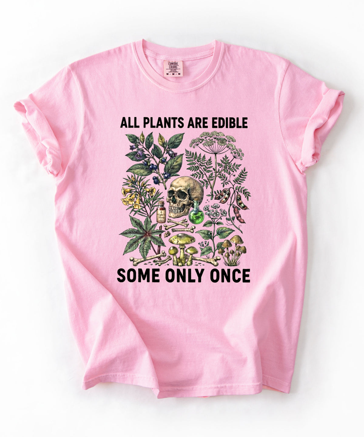 Botanical skull graphic tee in Blossom — "All Plants Are Edible, Some Only Once" garment-dyed t-shirt