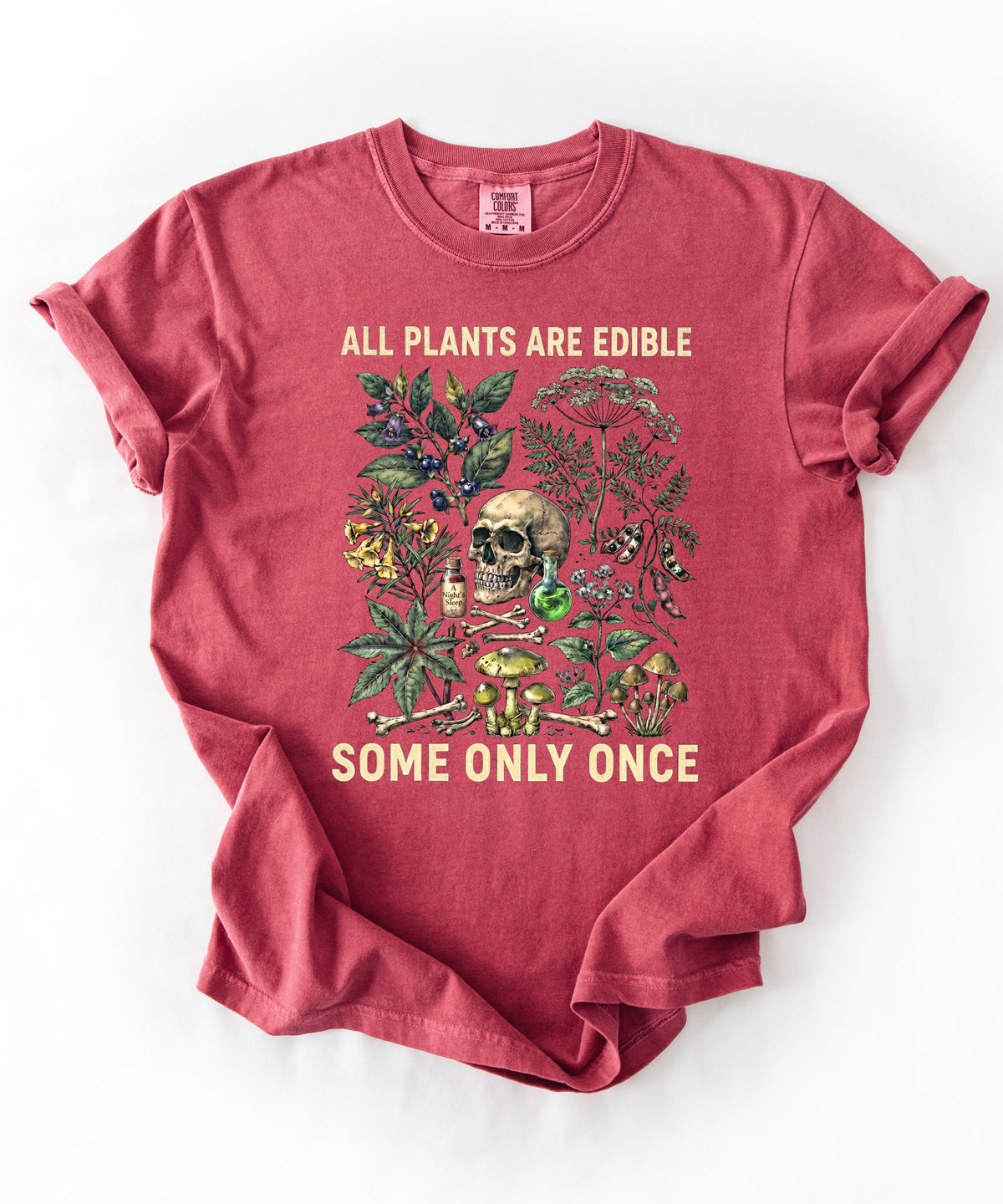 Botanical skull graphic tee in Crimson — "All Plants Are Edible, Some Only Once" garment-dyed t-shirt