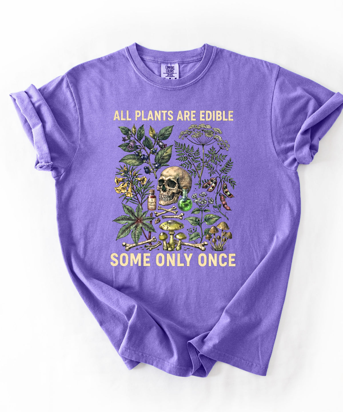 Botanical skull graphic tee in Violet — "All Plants Are Edible, Some Only Once" garment-dyed t-shirt