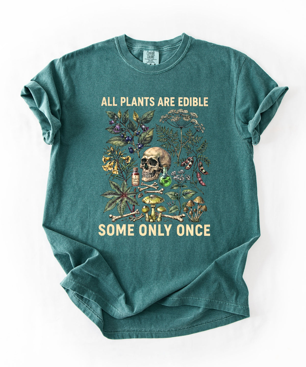 Botanical skull graphic tee in Blue Spruce — "All Plants Are Edible, Some Only Once" garment-dyed t-shirt