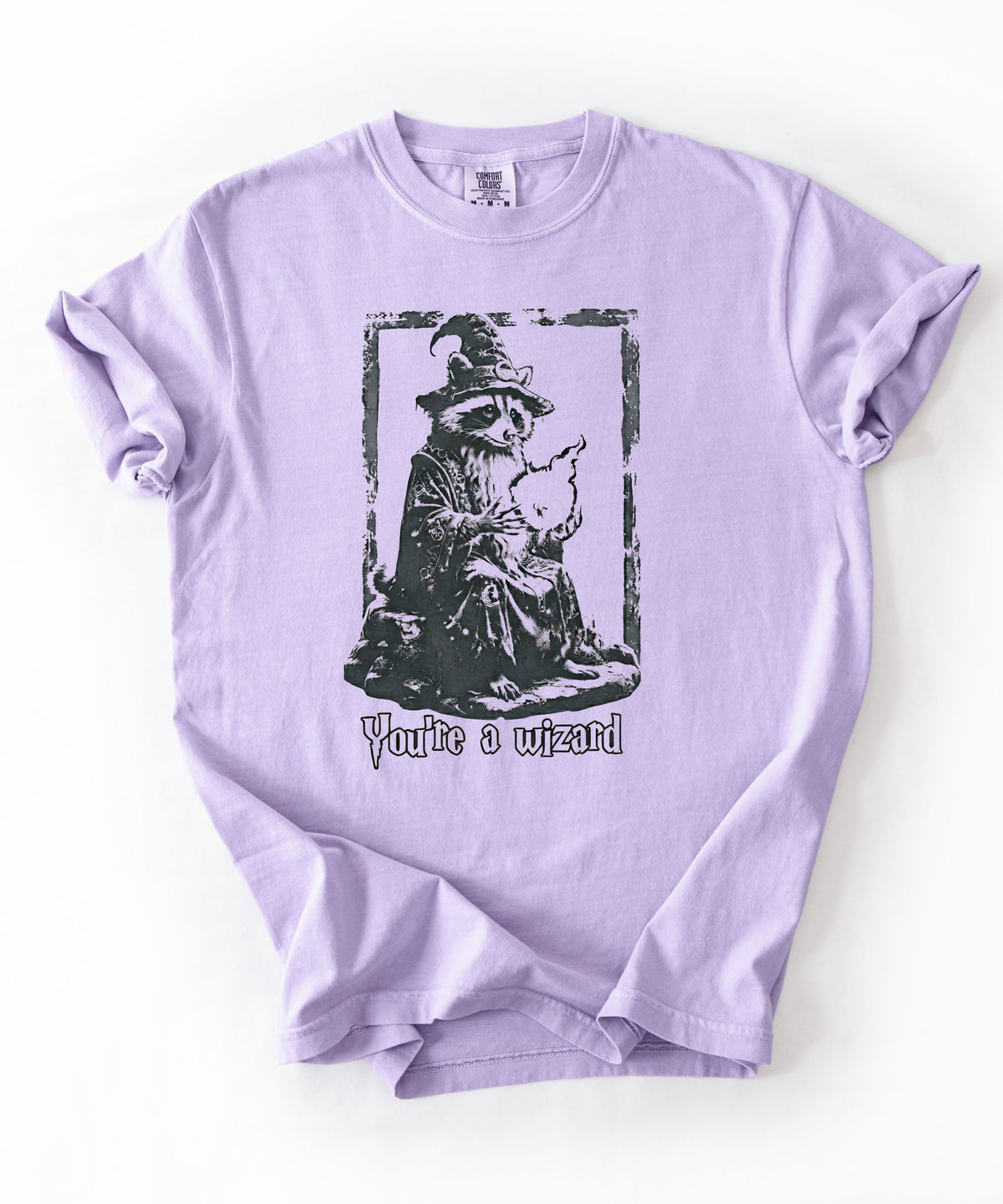 Funny wizard raccoon graphic tee in Orchid, vintage engraving style with "You're a Wizard Harry" text