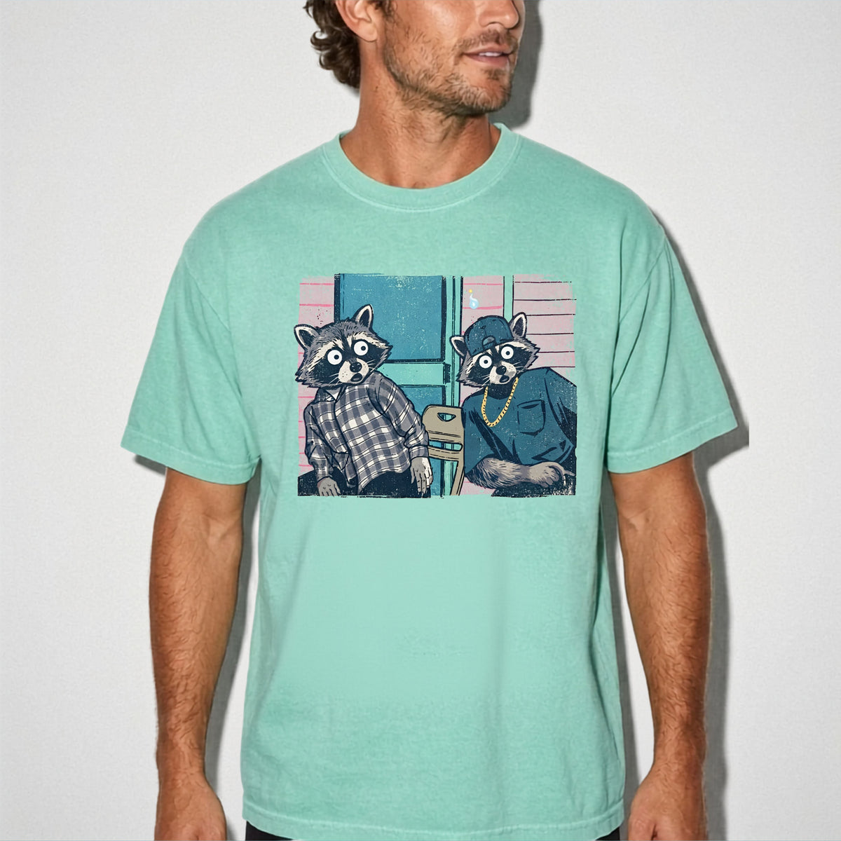 Two raccoon neighbors on a porch graphic tee in Island Reef, vintage pastel illustration meme design