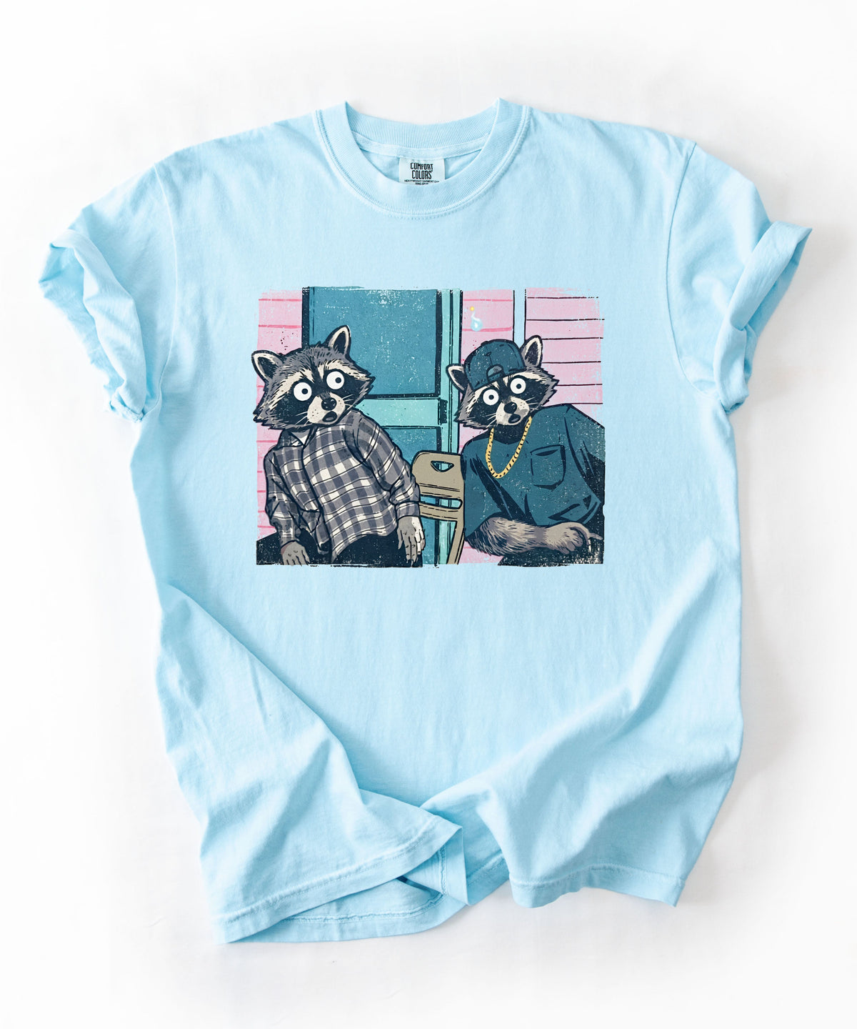 Two raccoon neighbors on a porch graphic tee in Chambray, vintage pastel illustration meme design