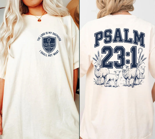 An off-white short-sleeve graphic T-shirt shown on a model from both the front and back. The front features a navy blue crest graphic with the text 'THE LORD IS MY GOD I WILL NOT WANT'.