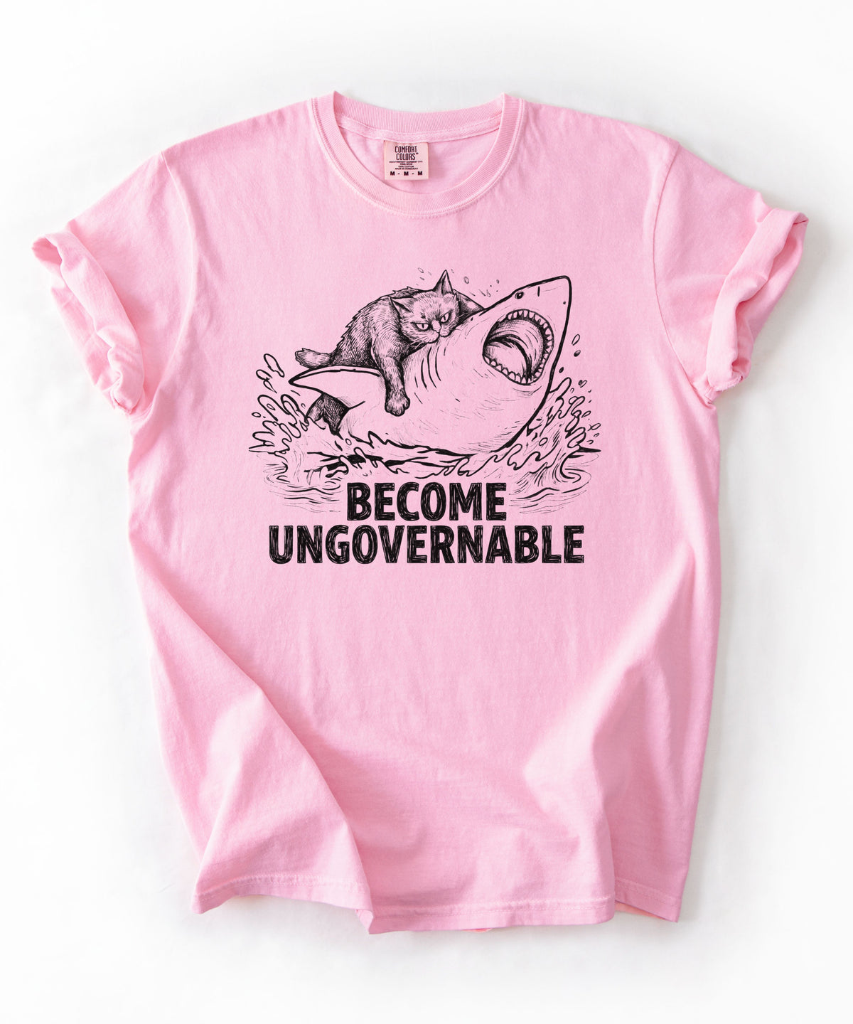Blossom t-shirt with a graphic of a cat on a Shark and the text 'BECOME UNGOVERNABLE'. 
