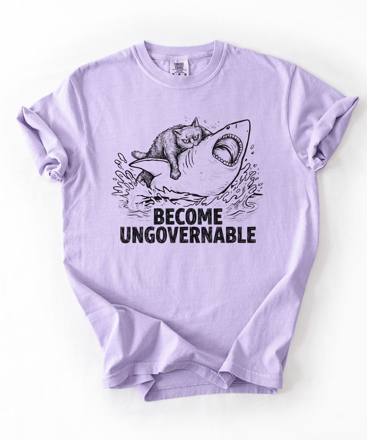 Orchid t-shirt with a graphic of a cat on a Shark and the text 'BECOME UNGOVERNABLE'. 