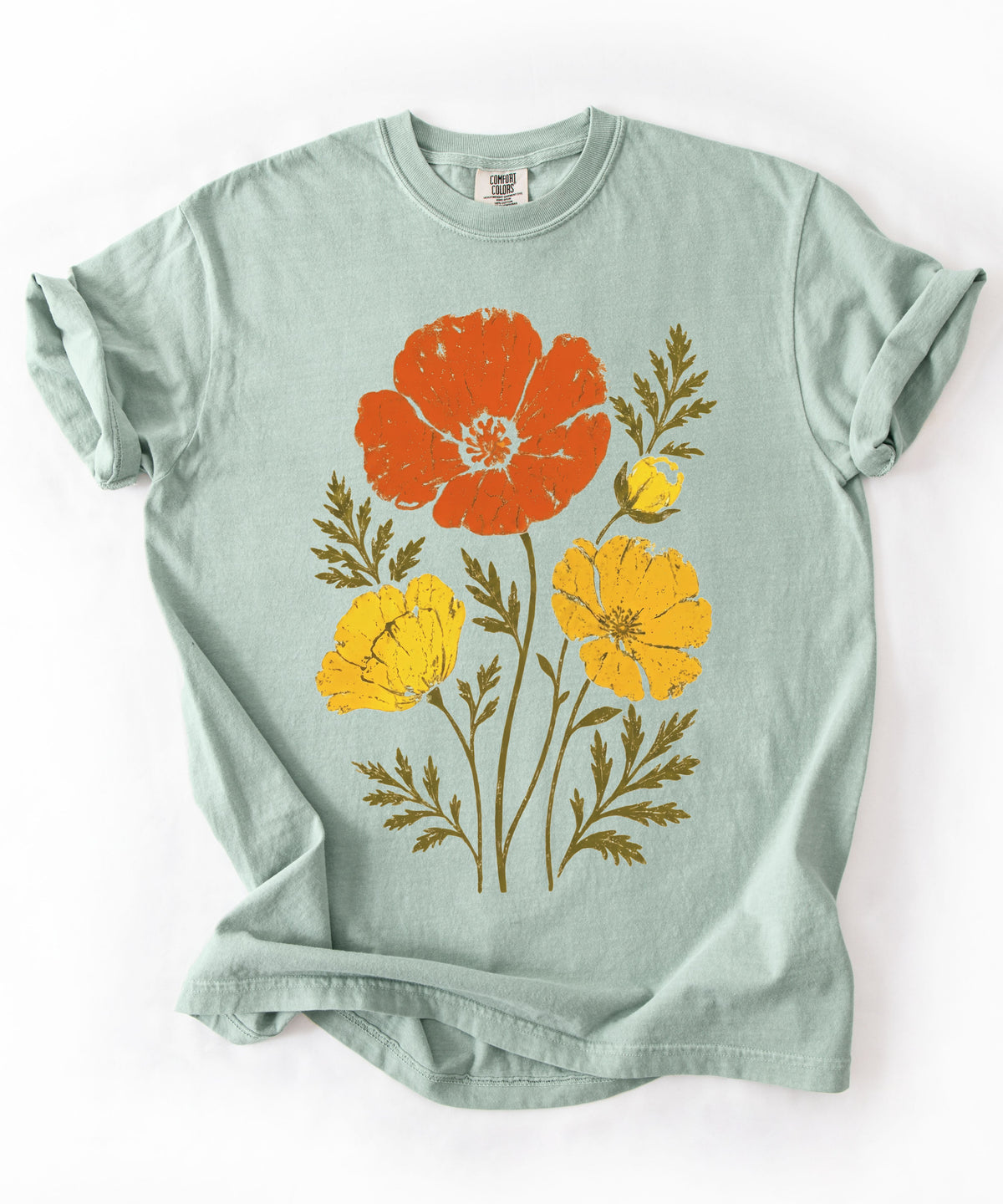 A  Bay green short-sleeve t-shirt with a graphic print of three stylized flowers (one orange, two yellow) with olive green leaves, laid flat 