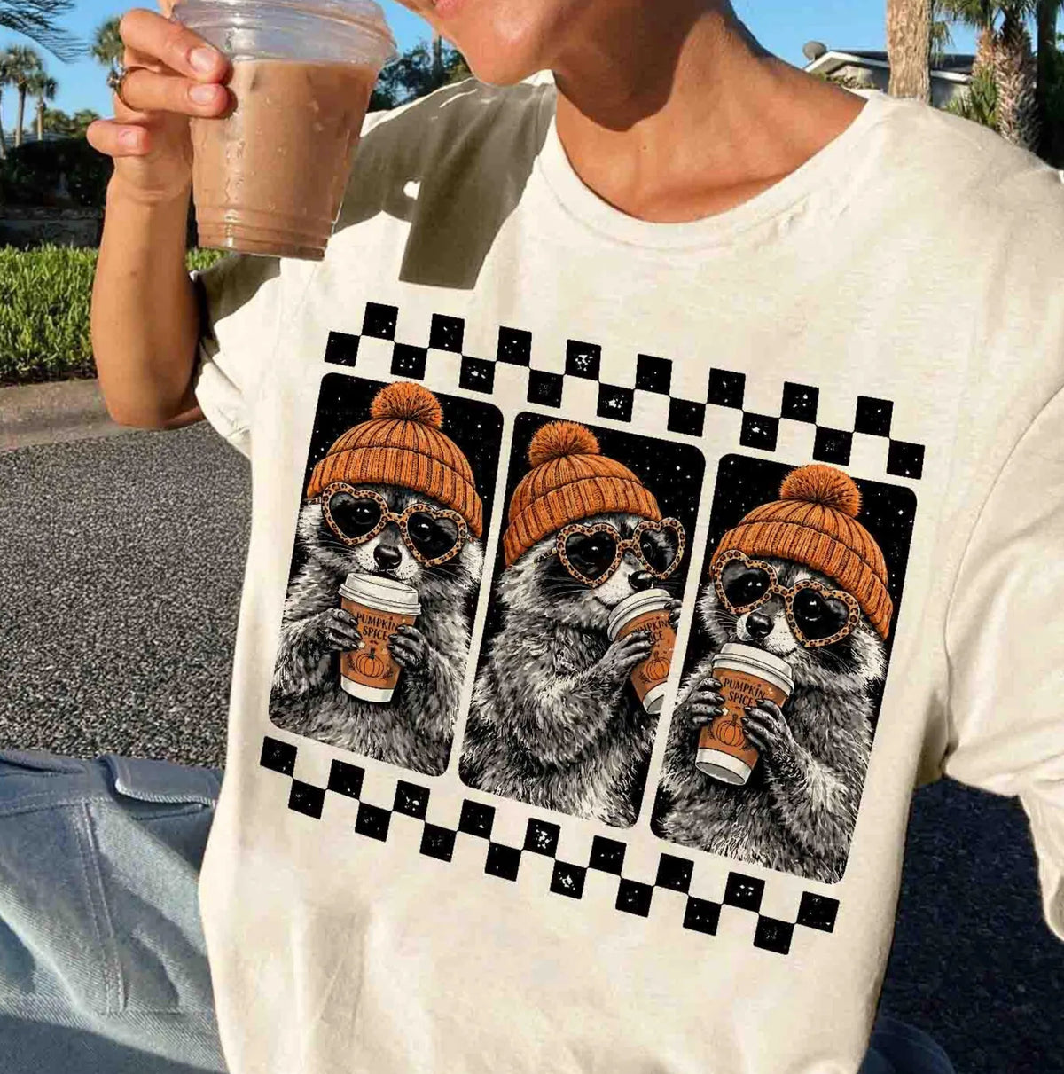 Ivory raccoon pumpkin spice coffee t-shirt — retro beanie raccoon checkerboard graphic fall tee