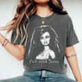 Pepper Y’all Need Jesus graphic T-shirt with a funny-faced doll design.