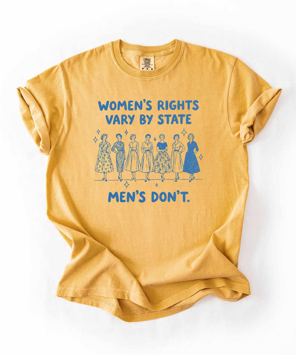 Mustard T-shirt with seven vintage women and blue text reading “Women’s rights vary by state. Men’s don’t.”