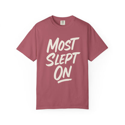 t-shirt with 'MOST SLEPT ON' text in white on a white background