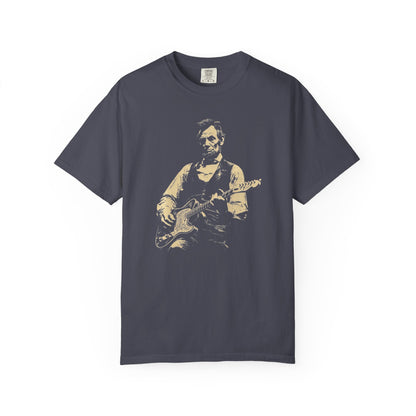 Navy blue t-shirt with a graphic of a president lincoln  playing guitar on a white background