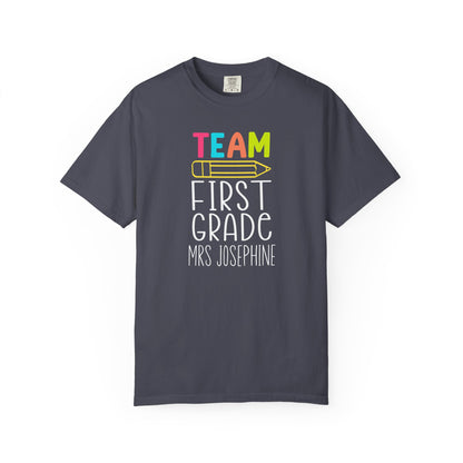 Navy blue t-shirt with 'Team First Grade Mrs Josephine' text on a white background
