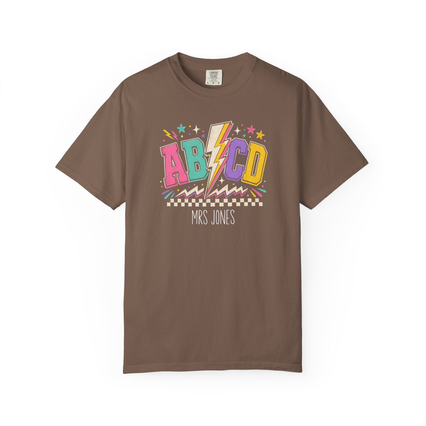 espresso t-shirt with colorful 'ABCD' design and 'Mrs. Jones' text on a white background