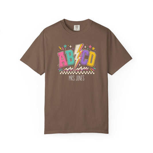espresso t-shirt with colorful 'ABCD' design and 'Mrs. Jones' text on a white background