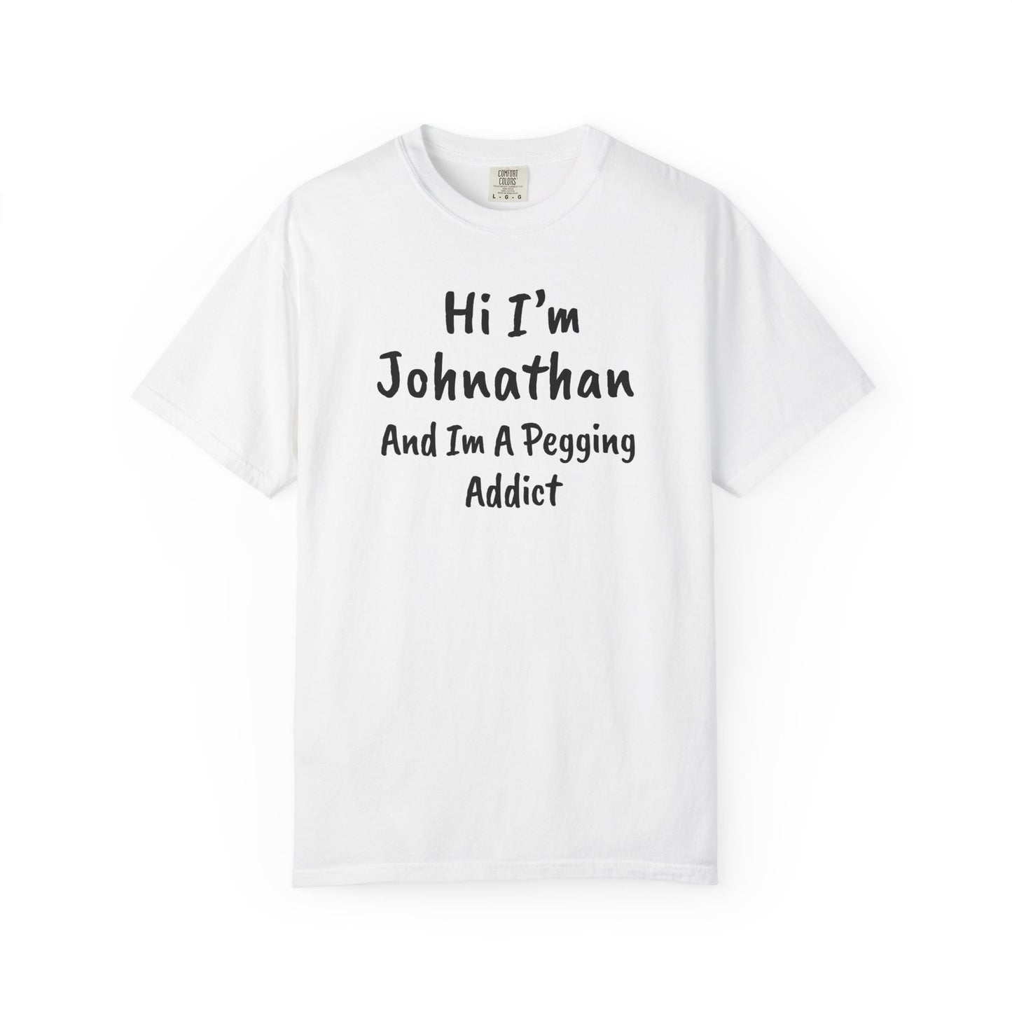 White garment-dyed heavyweight t-shirt with personalized 'Hi I'm [Name] And I'm A Pegging Addict' graphic in handwritten-style font, centered on chest
