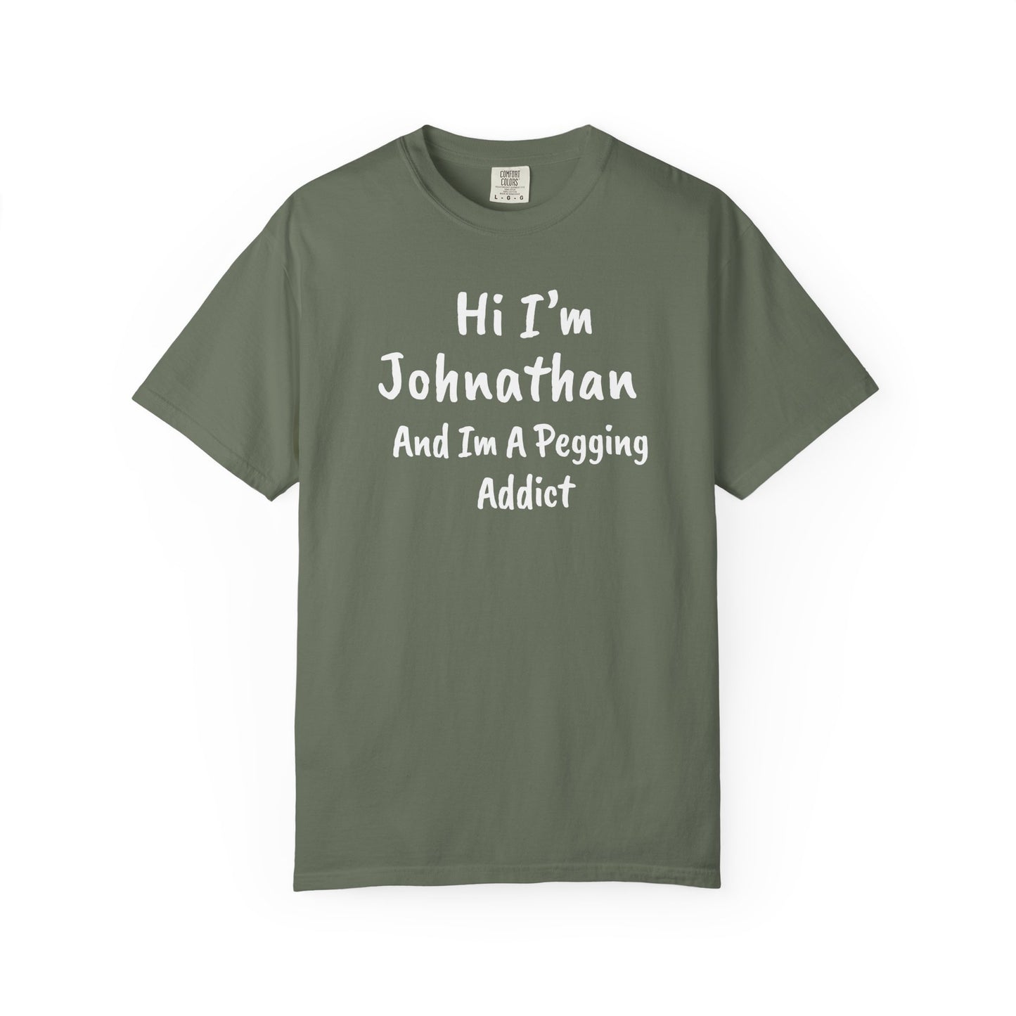 Moss garment-dyed heavyweight t-shirt with personalized 'Hi I'm [Name] And I'm A Pegging Addict' graphic in handwritten-style font, centered on chest
