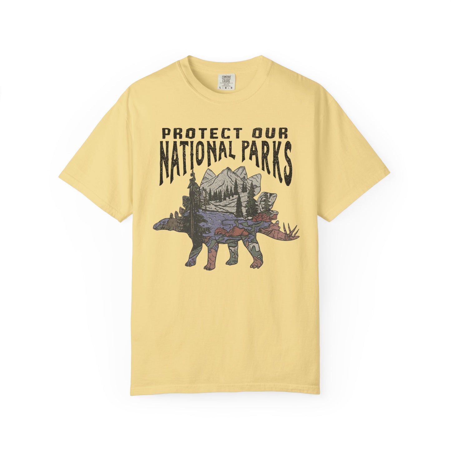 Protect Our National Parks garment-dyed t-shirt in Butter — vintage stegosaurus graphic with mountain landscape fill"
