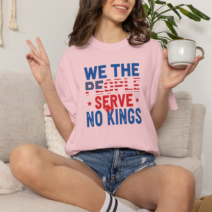 Person wearing a pink t-shirt with a political message, sitting on a couch holding a mug.