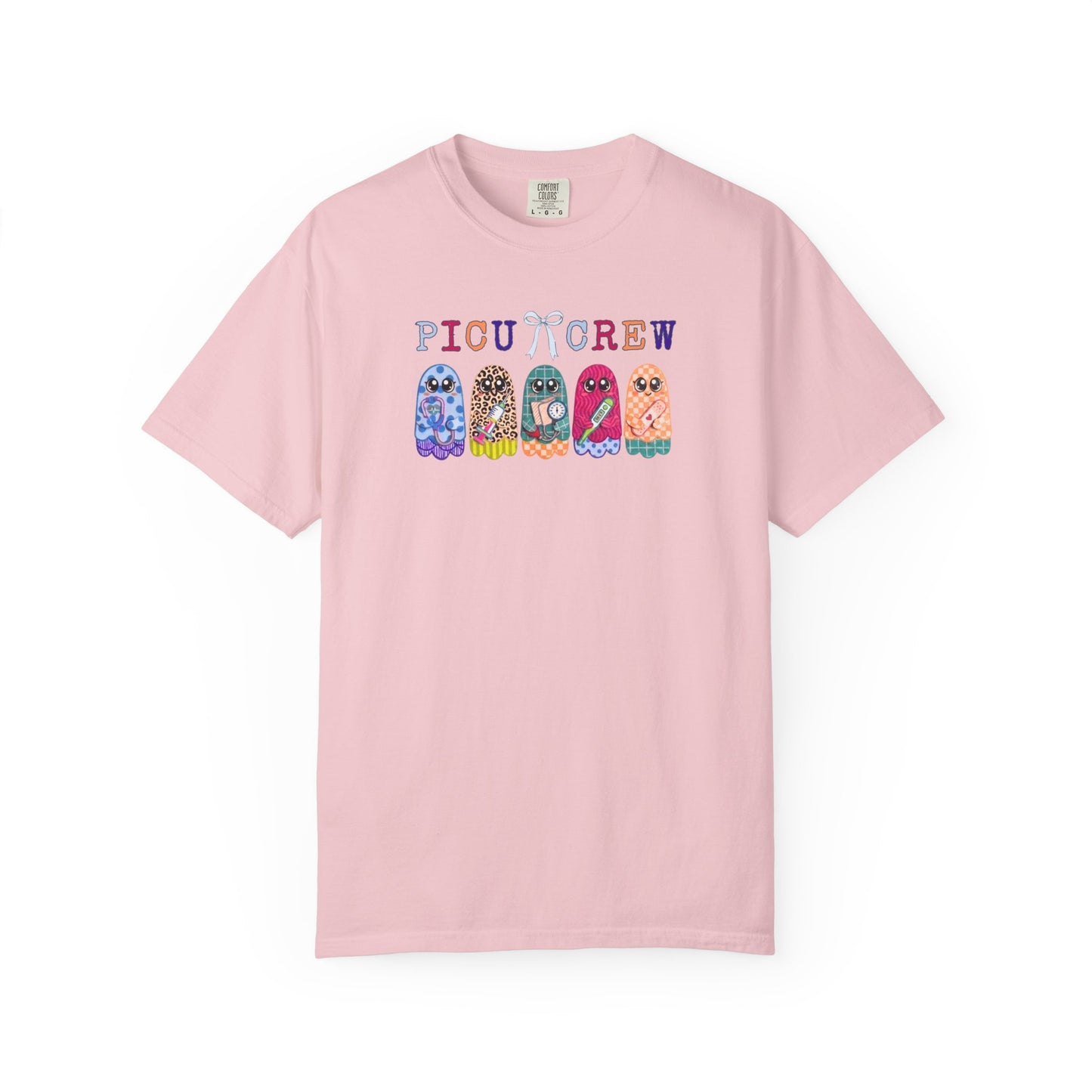 Blossom Comfort Colors PICU Crew t-shirt with five colorful patterned ghosts holding nursing tools — pediatric ICU nurse graphic tee, flat lay