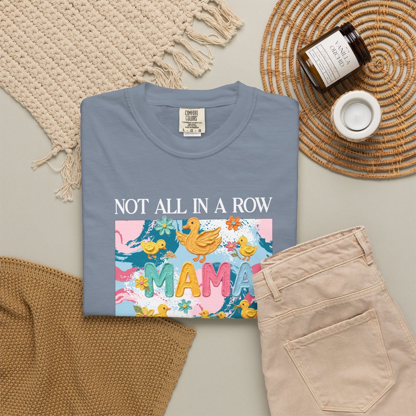 blue jean "mama" t-shirt with colorful graphic design featuring ducks and text on a white background.