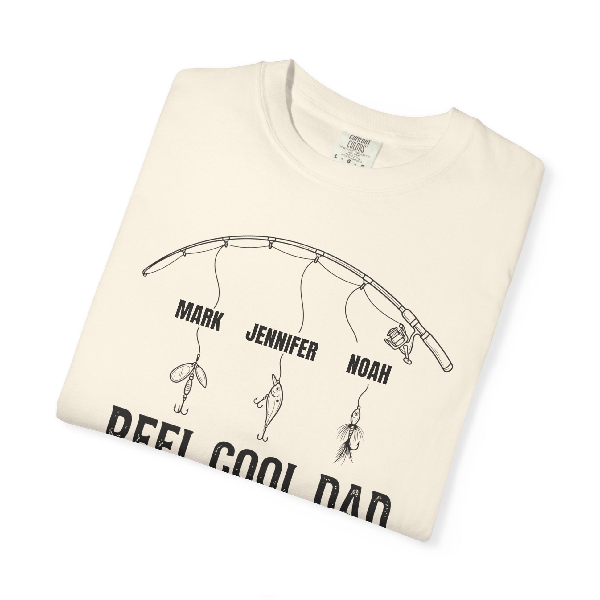 Folded ivory t-shirt with fishing graphic and text on a white background
