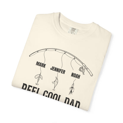 Folded ivory t-shirt with fishing graphic and text on a white background