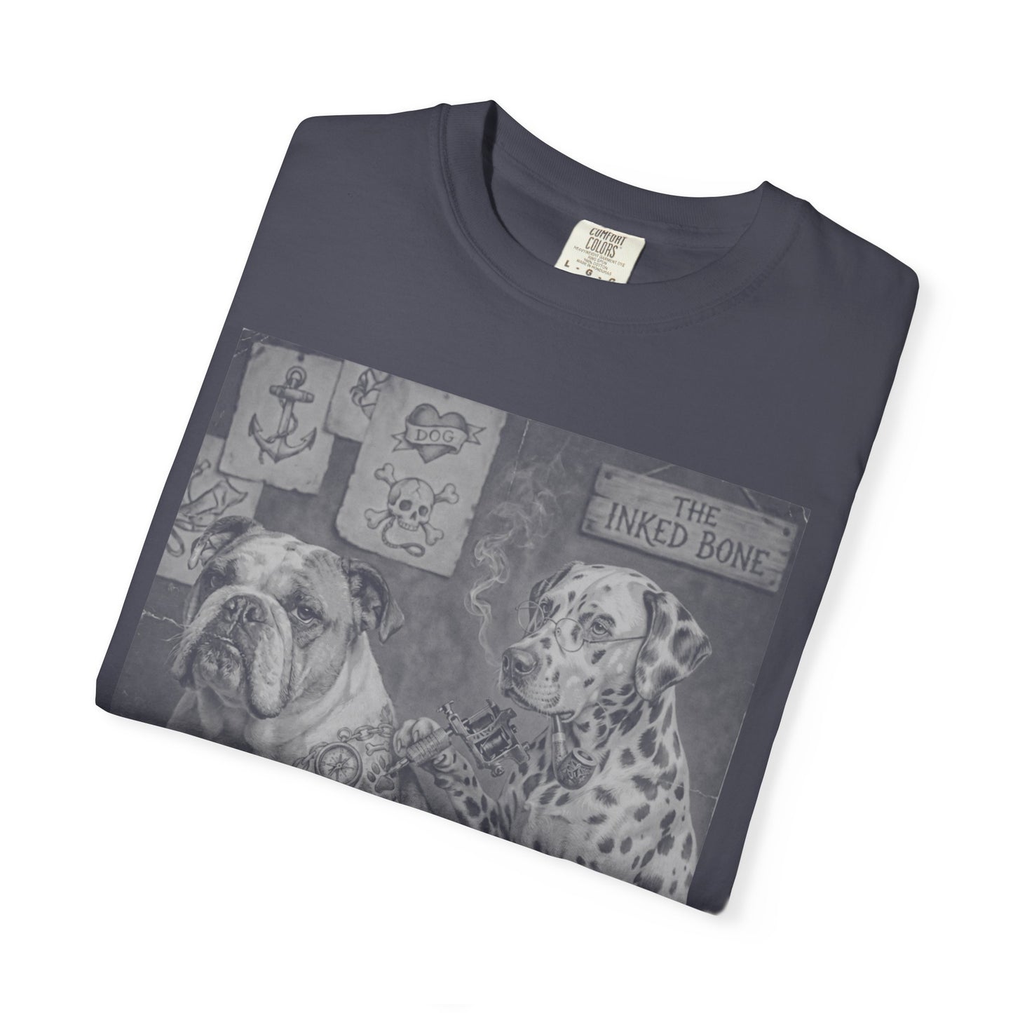 Folded navy garment-dyed t-shirt showing Bulldog and Dalmatian vintage tattoo parlor graphic — The Inked Bone design, Comfort Colors label visible