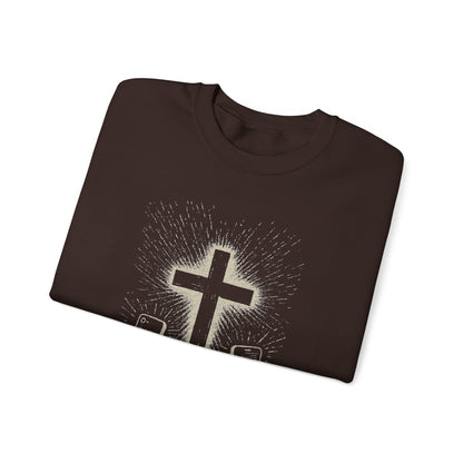 Person wearing a chocolate sweatshirt with a graphic design of hands holding smartphones with crosses on the screens.

