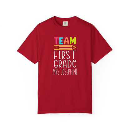 Red t-shirt with 'Team First Grade Mrs Josephine' text on a white background