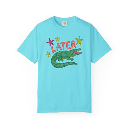 chalky mint t-shirts with alligator graphics on front "later gator" and the text on back i"n a while crocodile"a plain background