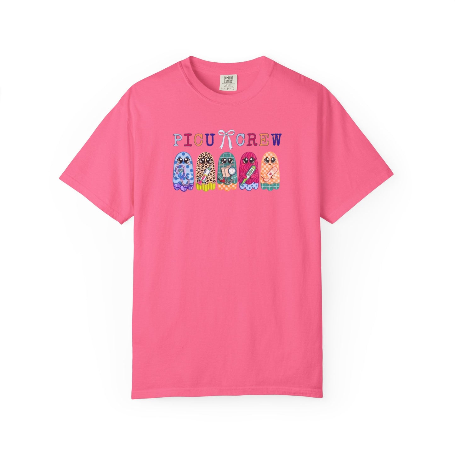 Crunchberry Comfort Colors PICU Crew t-shirt with five colorful patterned ghosts holding nursing tools — pediatric ICU nurse graphic tee, flat lay
