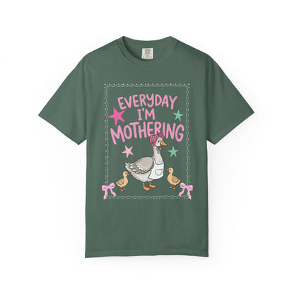 bruce spruce t-shirts with front and back graphic designs of a mother goose her ducklings with phrase "everyday im mothering" and text on a white background